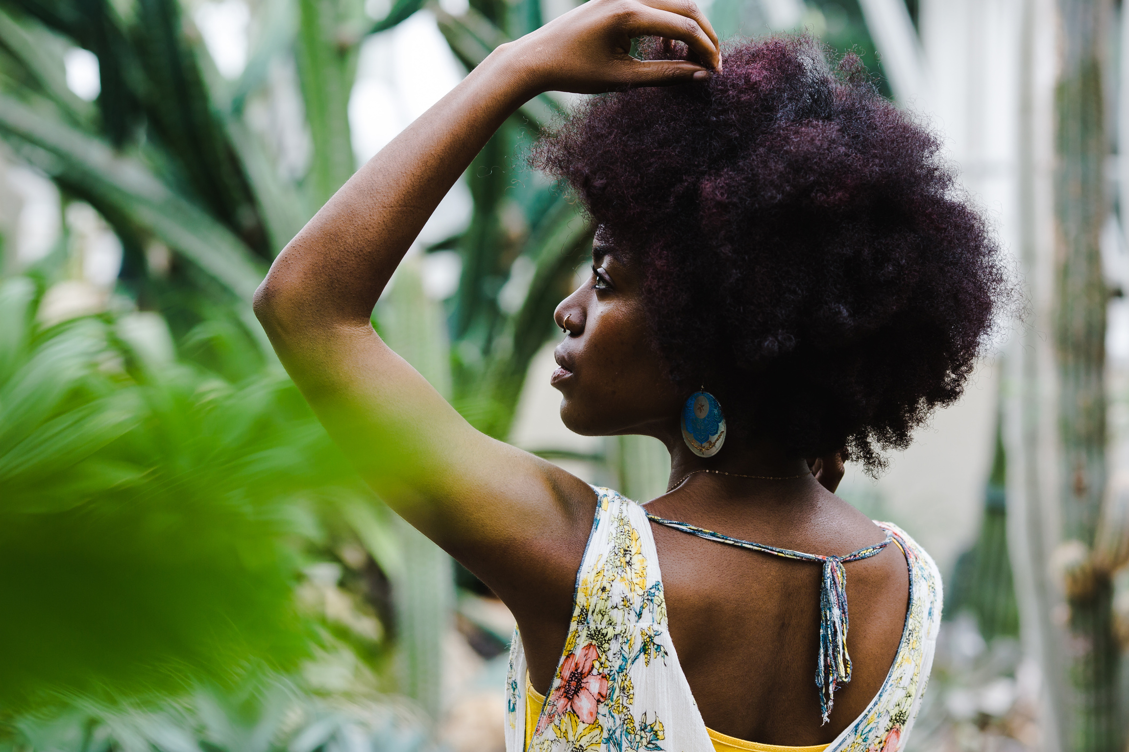 Woman with Afro Hair Posing Outdoors